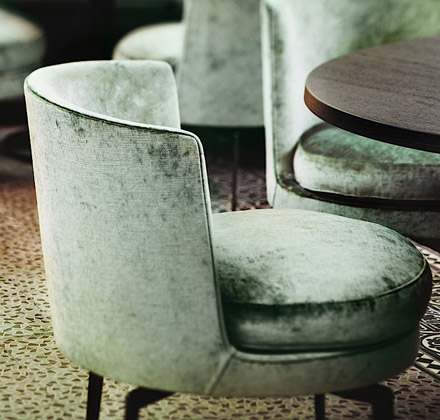 Green velvet chairs by Flexform in The Jane restaurant, Antwerp, Belgium, designed by Piet Boon