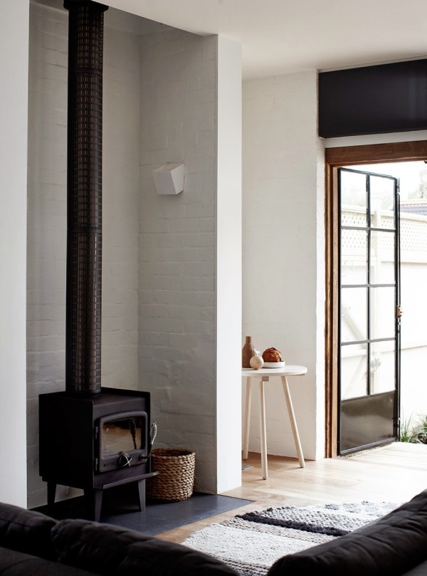 Wood stove in an Australian Barnhouse, Melbourne, designed by Whiting Architects