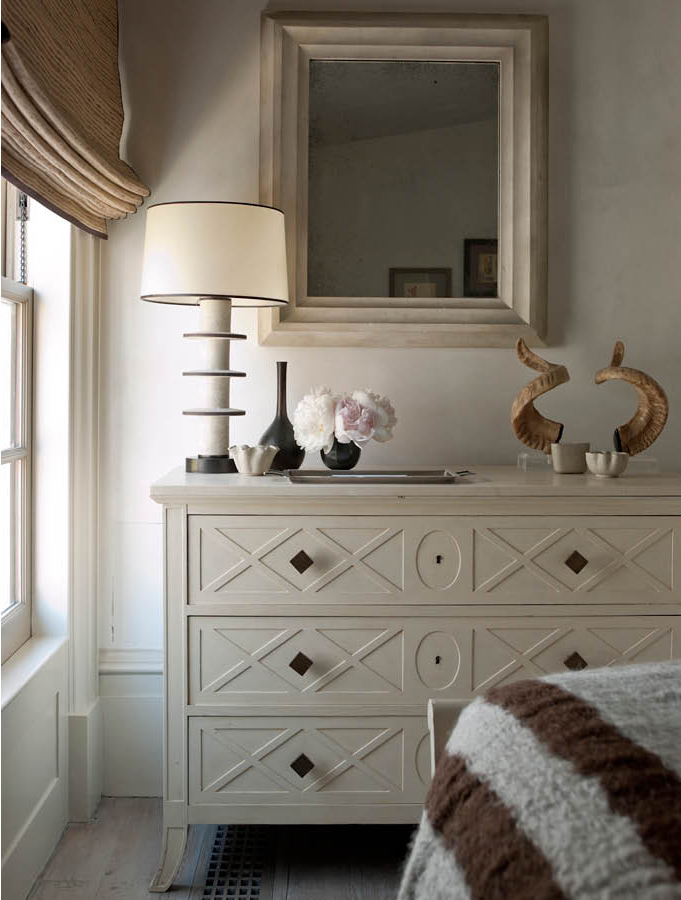 African Steenbok antlers on a bedroom sideboard, designed by Steven Gambrel