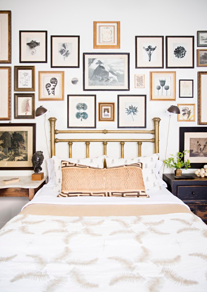 Color-coordinated gallery wall in this eclectic bedroom - via Brittany Ambridge Photography