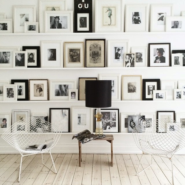 Lots of frames and two Bertoia chairs in the home of Danish novelist Annika von Holdt - via My Scandinavian Home