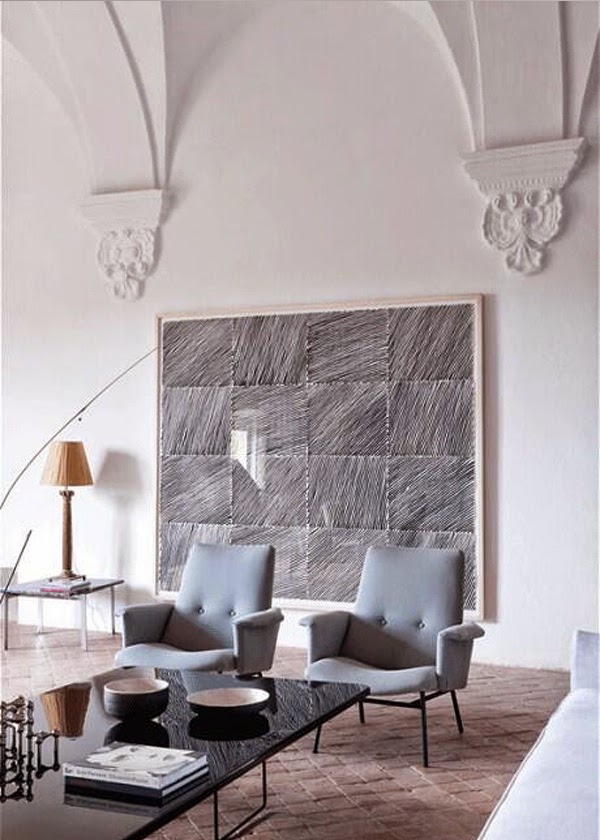 Mid Century armchairs by Gio Ponti and painting in a 15th century palace in Girona, Spain - via Belle Vivir