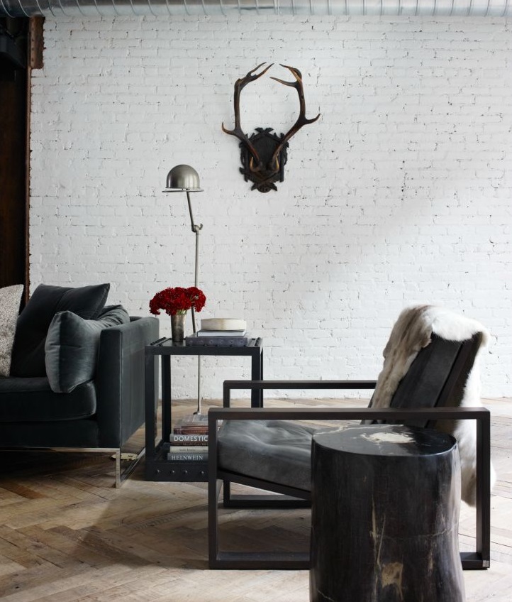 Vintage antlers in this bachelor loft designed by NY designer Jenny Wolf