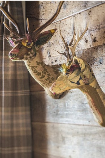 deer heads made out of patchworked tapestry fabric instead of real deer  - via Todaloos