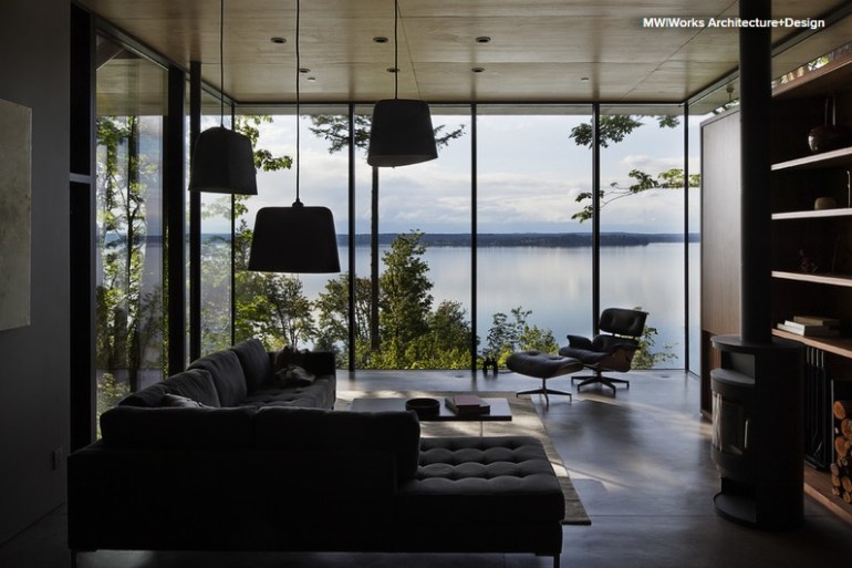 Concrete floor, mirroring the surface of the lake, in this contemporary cottage designed by MW Works Architecture and Design - via Houzz