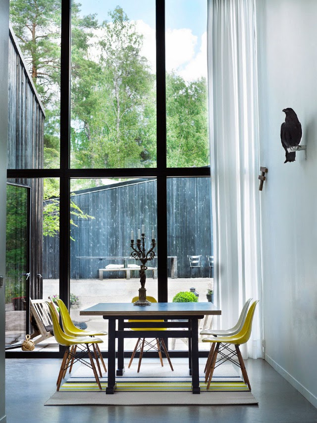 Yellow Eames chairs in a Swedish lake house - via My Scandinavian Home