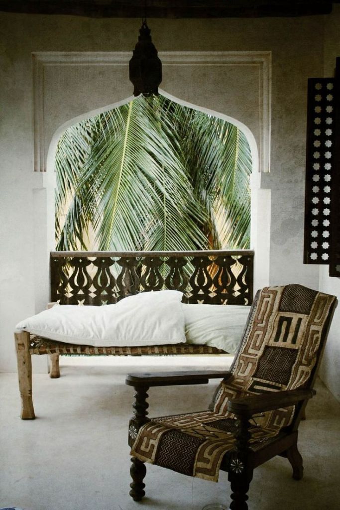 Arabian architecture, Indian daybed and African planter's chair with a tribal cover - via Love.Repeat.