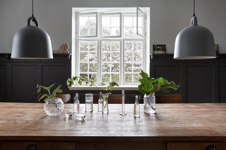 Beautiful in its simplicity - old glass bottles and jars with a few garden greens - via Coco Lapine