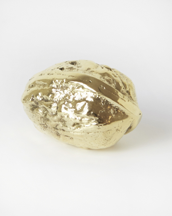 Golden walnut paperweight by Artilleriet