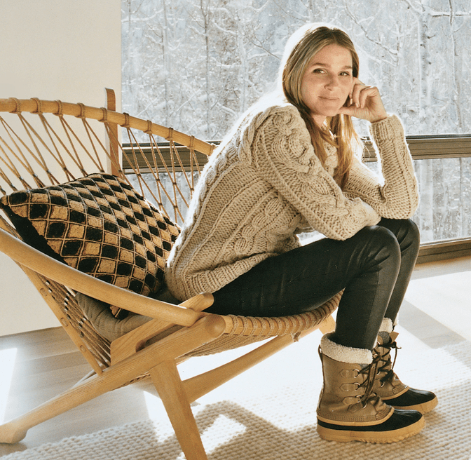 Aerin Lauder relaxing in the Hoop Chair, originally designed in 1965 and taken into production in 1985 by PP Mobler