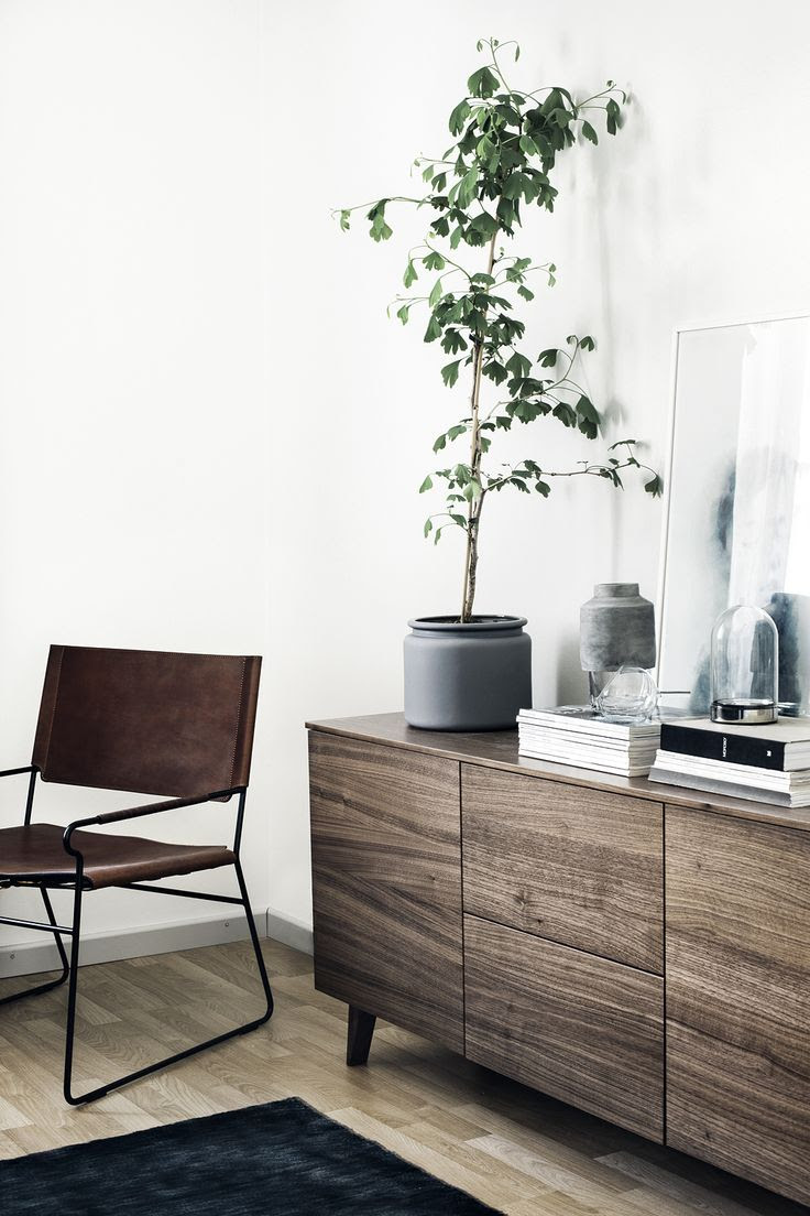 Simplicity examplified, this walnut sideboard in a Finnish home - via Coco Lapine