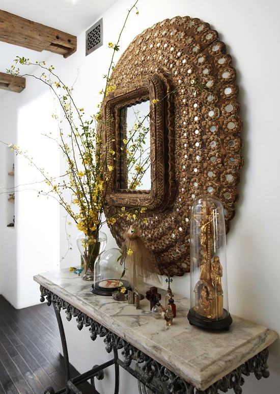 Beautiful Indian mirror over a French pastry table, great combination