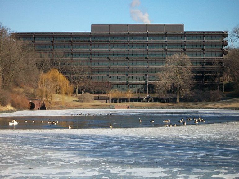 John Deer Headquarters, designed by Eero Saarinen, inspired by the style of Mies van der Rohe, completed in 1964