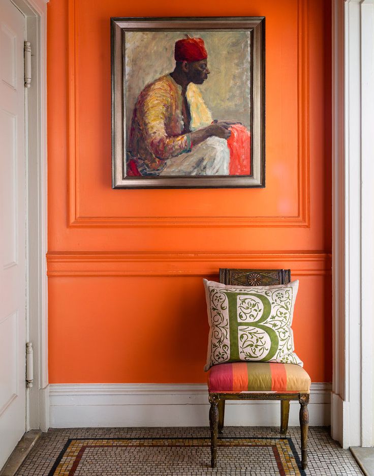 Orange wall in designer Sheila Bridges' New York apartment via the New York Times