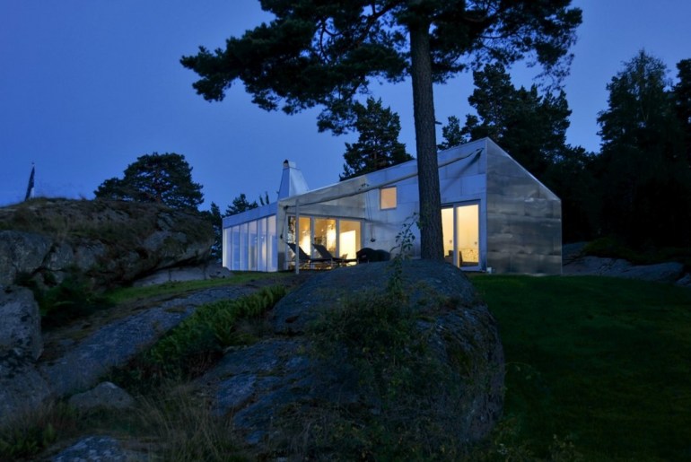The aluminum walls reflecting the blue night