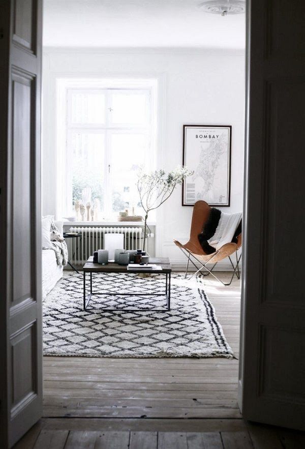 Black and white interior with the butterfly as an accent - via DustJacket