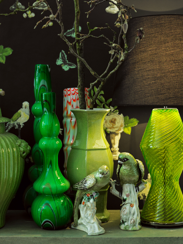 Green collection of glass and porcelain vases and some beautiful birds, styled by Annabell Kutucu - via Villa Harteneck